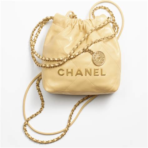 CHANEL 22 Mini Handbag Shiny Calfskin & Gold .